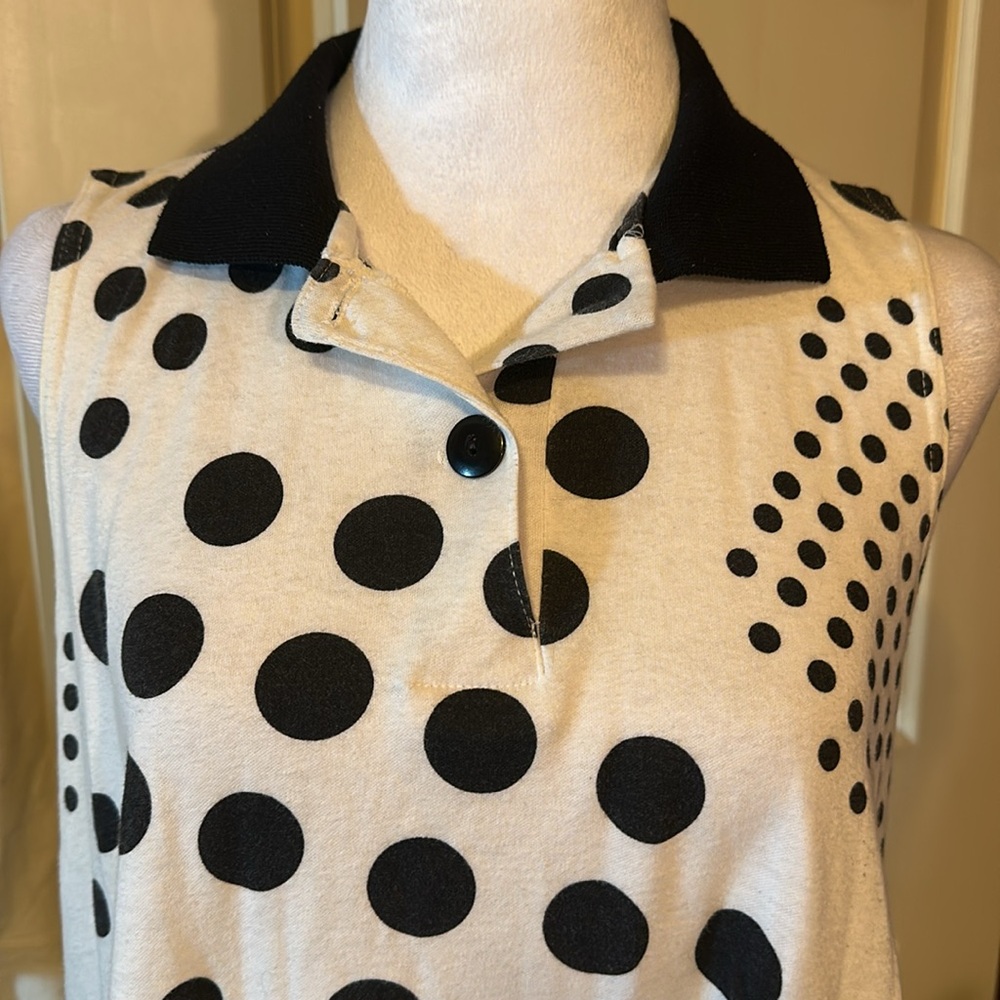 Black & white polka dots pit to pit 22” flares out from arm pit down